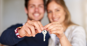 Couple holding a house key
