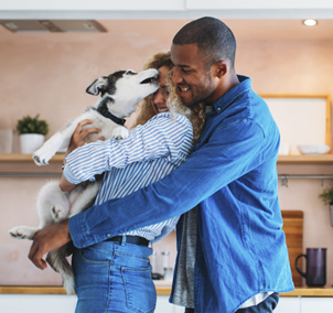 Couple hugging a dog